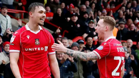 Wrexham's Callum Doyle celebrates putting his side 4-3 up against Ipswich Town