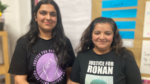 Nikita Kanda and Pooja Kanda are both wearing T-shirts with slogans calling for justice for Ronan and the campaign against knife crime. Both have dark long hair and Nikita is taller than her mother.