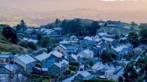 An aerial view of dozens of grey brick terraced homes in Blaenau Ffestiniog, Gwynedd