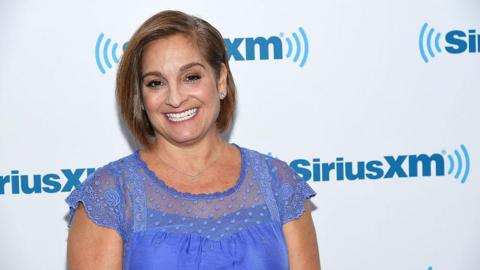 Gymnast Mary Lou Retton visits at SiriusXM Studio on August 9, 2016 in New York City. She wears a blue top.