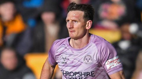 Shrewsbury Town captain Will Boyle in action during a match