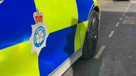 A North Yorkshire Police car in a parking space