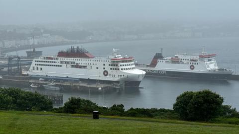 The Manxman in Douglas Harbour alongside the Ben-My-Chree in Douglas Harbour on a rainy day.