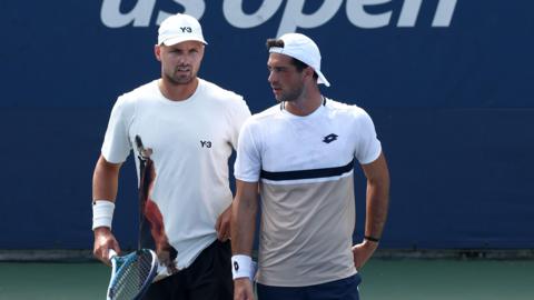 Lloyd Glasspool and Julian Cash playing in their first-round doubles match at the US Open in New York