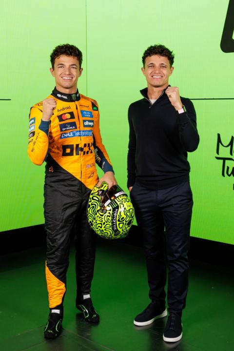 Lando Norris standing next to his wax work double. 
