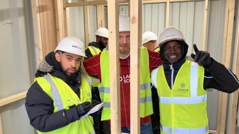 Group of young men at a construction site