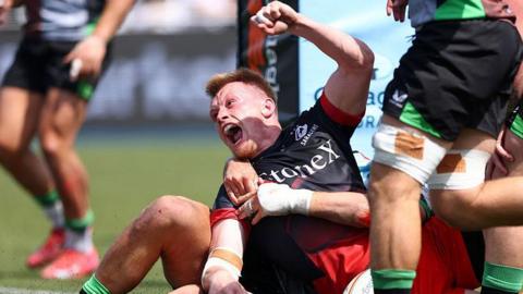 Nick Tompkins roars in delight as he celebrates scoring Saracens' third try in their win over Harlequins.