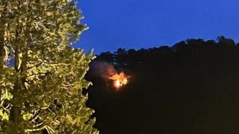 A small wildfire on grassland on a cliff beneath Surprise View, Borrowdale, Keswick.