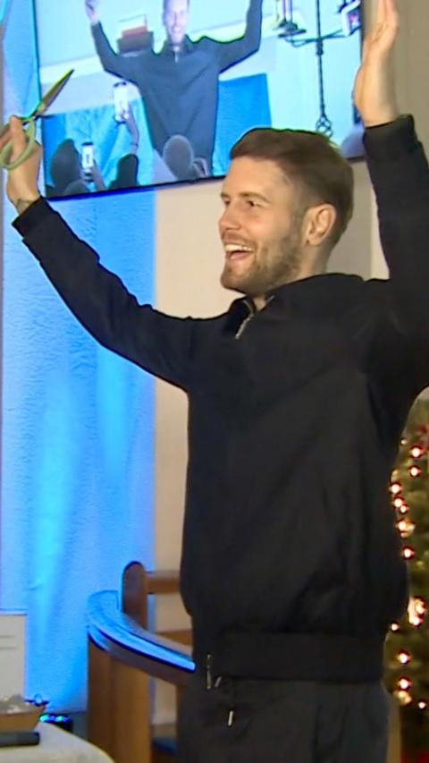 Fabian Hurzeler raising his arms and smiling.