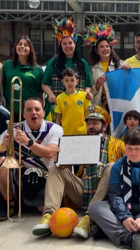 Group of people with flags and signs