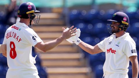 Ben Kellaway and Kiran Carlson of Glamorgan celebrate 