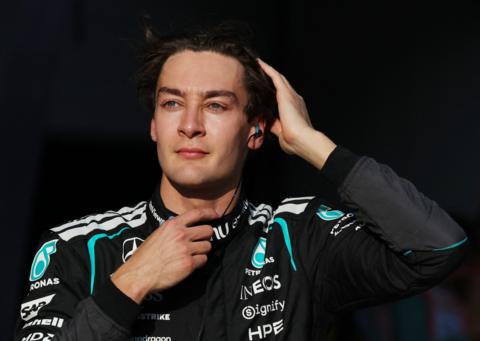George Russell runs his right hand through his hair as he prepares for the start of the 2026 Japanese Grand Prix