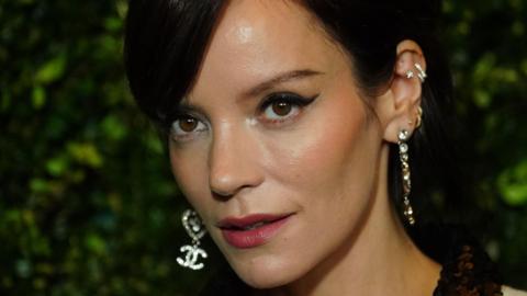 Close up of Lily Allen with dangly earrings