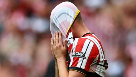 Sheffield United's Harrison Burrows pulls his shirt over his head after the play-off defeat to Sunderland