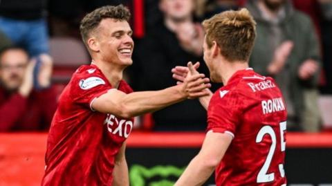 Aberdeen's Lewis Smith celebrates with Connor Ronan