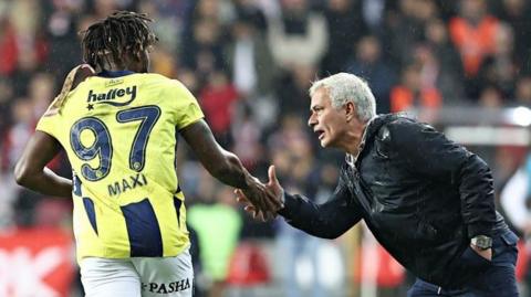 Fernerbahce's Allan Saint-Maximin and Jose Mourinho celebrate