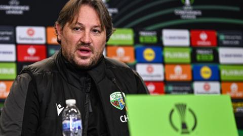 Craig Harrison speaking at a Conference League press conference