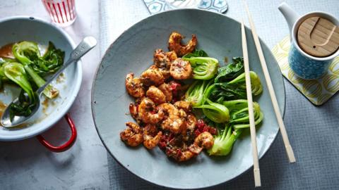 Firecracker prawns with stir-fried greens
