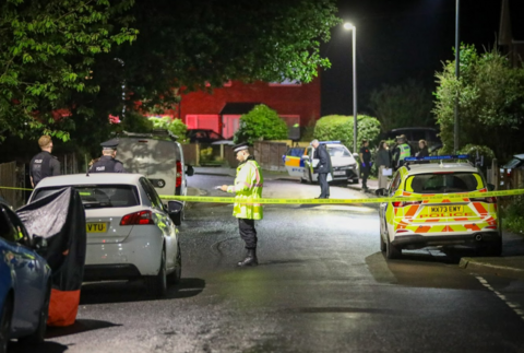 Police at the scene of the shooting in Aspinall Close