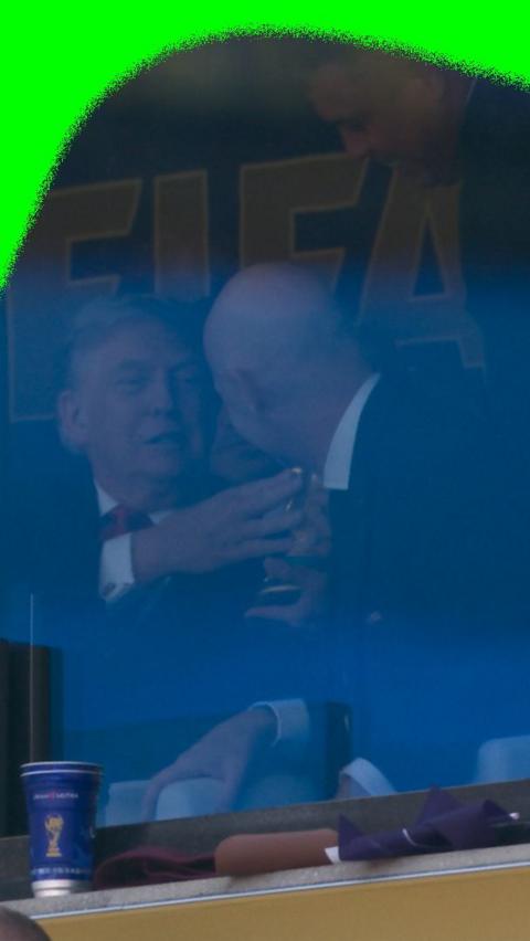 Donald Trump and Gianni Infantino with the World Cup trophy as they watch the final.