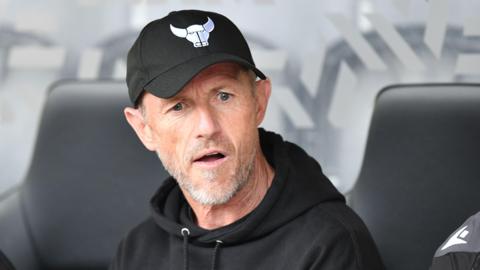 Gary Rowett looks confused in the Oxford United dugout