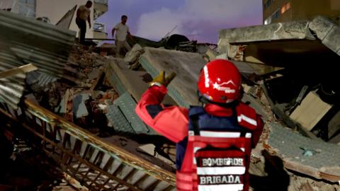 Members of the Fire Department rescue a person after two strong earthquakes struck the Venezuelan Caribbean; in Caracas, Venezuela, 24 June 2026. 