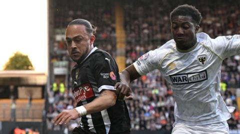 Notts County's Jodi Jones (left) in action against AFC Wimbledon