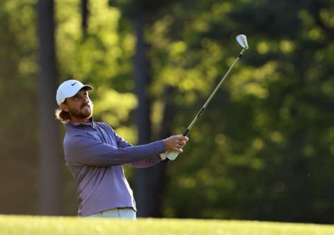 Tommy Fleetwood plays an iron shot on day two of the 2024 Masters