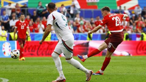 Michel Aebischer scores for Switzerland against Hungary