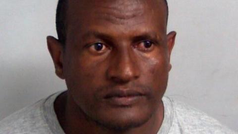 Custody shot of Hadush Kebatu