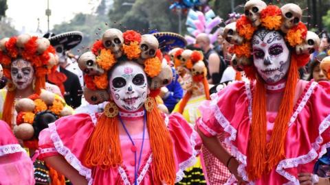 two girls dressed up to celebrate Día de los Muertos in Mexico