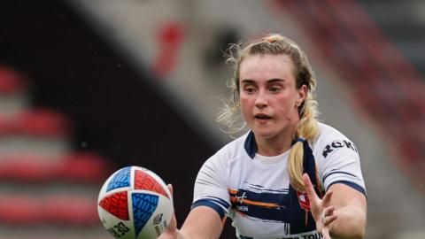 Paige Travis in action for England against France in 2024