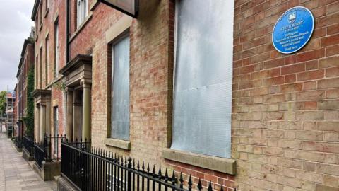 An outside view of the boarded up Edith Rigby home in Preston 