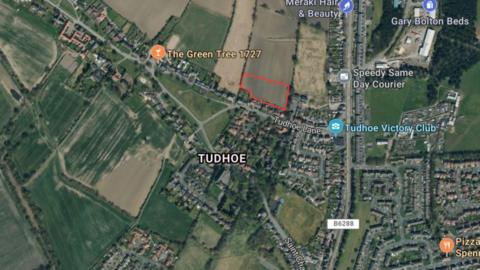 An aerial view of Tudhoe village. The small plot of land behind Tudhoe Lane, where the development would have been, is highlighted in red. 