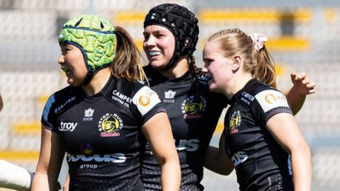 Exeter celebrate scoring a try against Leicester