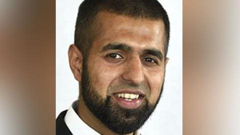 Head shot of Sohail Asghar. He has short dark hair and a beard, but no moustache