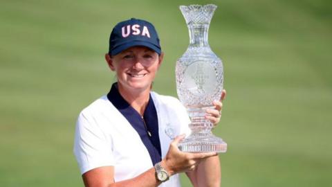 Stacy Lewis holding the Solheim Cup