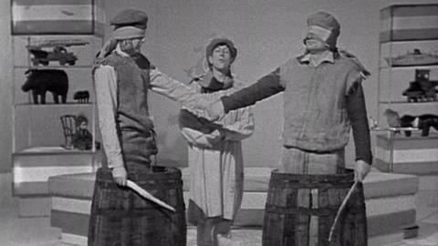 John Noakes stands between two expert Rhubarb thrashers