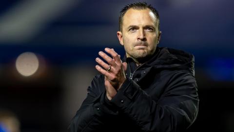 Chris Davies claps the crowd after a Birmingham City match