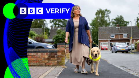 A woman with a golden labrador guide dog