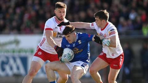 Cavan's Cian Reilly fights to hold on to possession during Sunday's Ulster Championship clash with Tyrone in Omagh