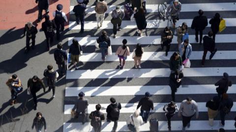 Commuters crossing Tokyo's Shibuya crossing