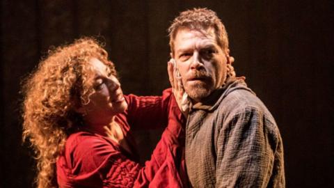 GCSE English Literature image: Kenneth Branagh as Macbeth looking troubled, Alex Kingston as Lady Macbeth holding his face