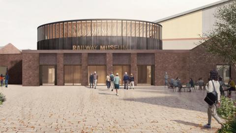 An artist's digital impression of a large, paved square with red brick buildings surrounding it. One is a large, dome-like structure.