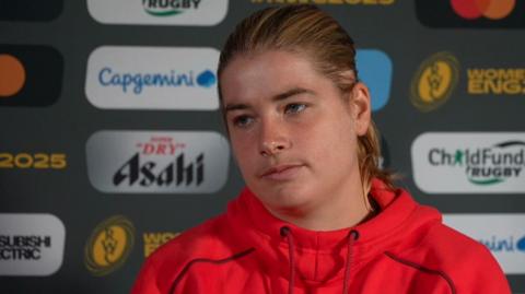 Bethan Lewis speaks to the media