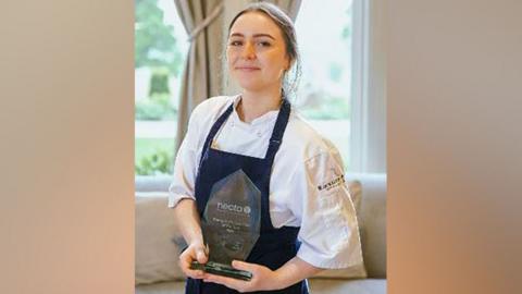 Abigail Smith holding her trophy