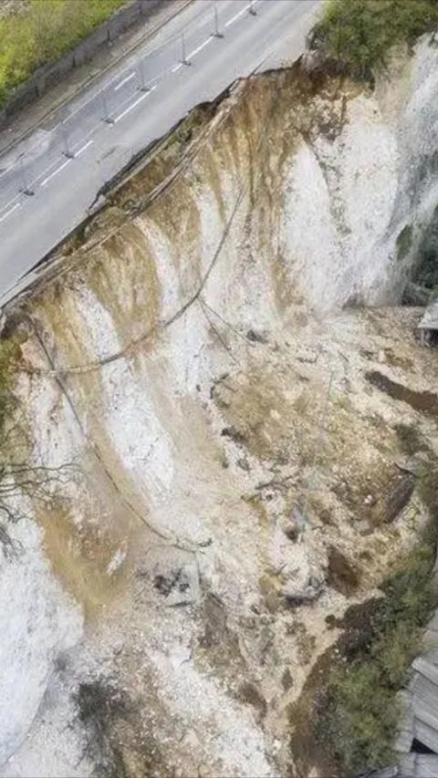 Aerial shot of chalk cliff after a landslip with a road above