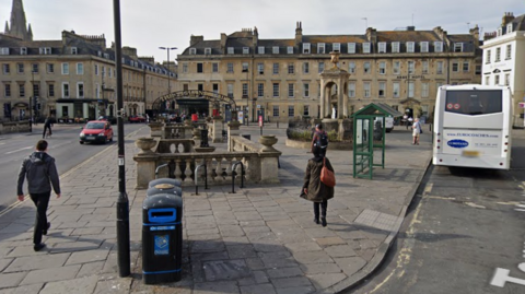 Terrace Walk in Bath. It has a bust stop and pavements either side of the road.