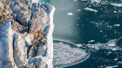 Calving at the front terminus of the Hisinger Glacier, Dickson fjord, Northeast Greenland National Park.
