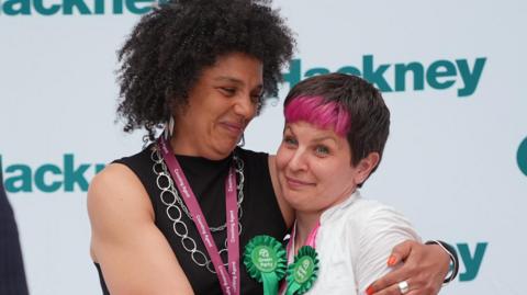 Green Party candidates Rachel Nkiessu-Guifo (left) and Zoe Garbett are declared winners in the 2026 London Borough of Hackney council election,